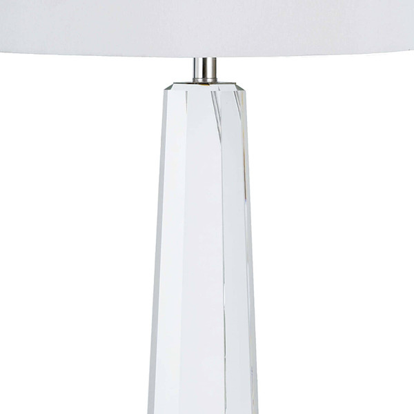 The polished nickel finishing of a crystal lamp